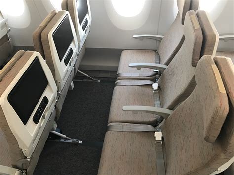 The upper deck is laid out in a 2-4-2 pattern, and window seats get an extra storage compartment. . Asiana airlines economy smart vs classic